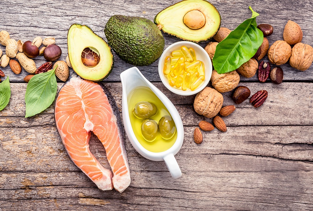keto ingredients like salmon olives avocado, nuts, pecans spinach
