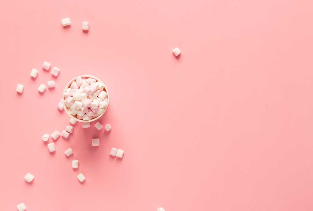 marshmallows on a pink background