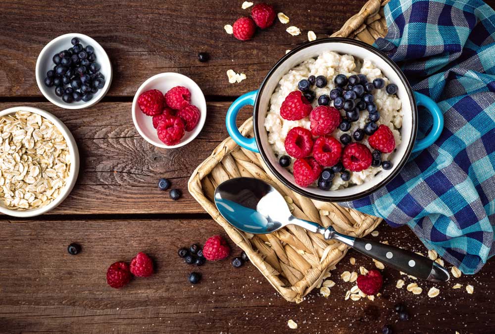bowl of oatmeal with berries on top