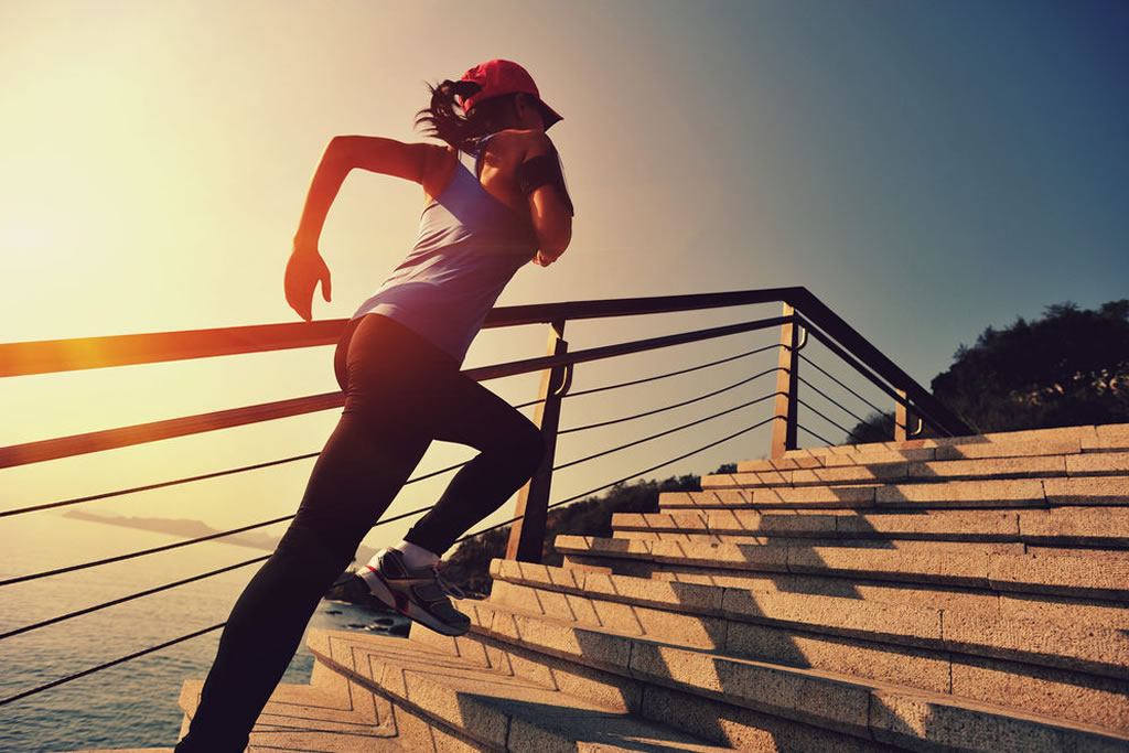 lady running up stairs workout