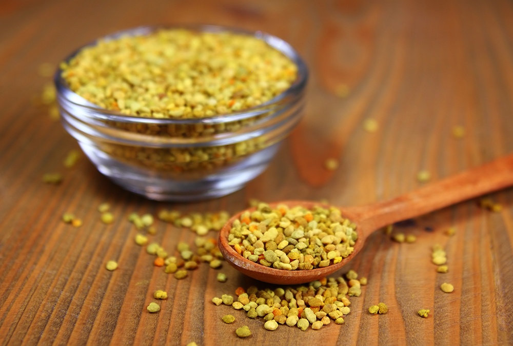 cup and spoonful of bee pollen.