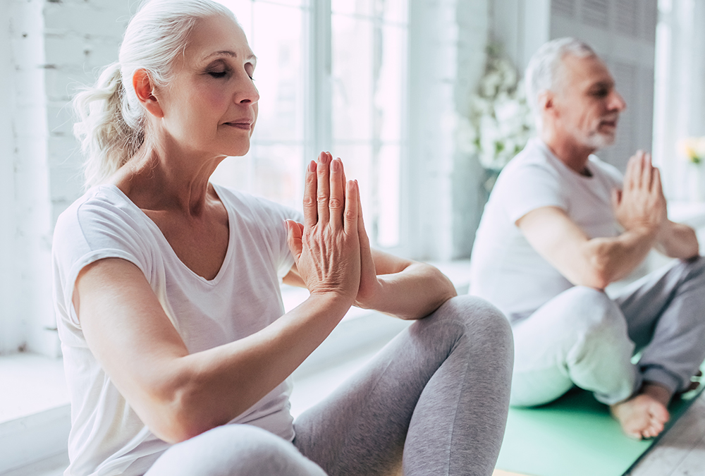 older adults doing yoga